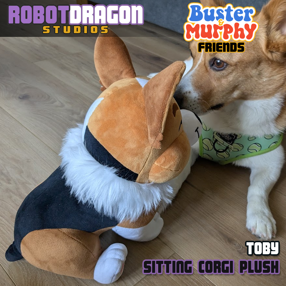 Corgi dog playing with a limited edition red tricolor corgi plush, a friend of Buster and Murphy from Robot Dragon Studios.