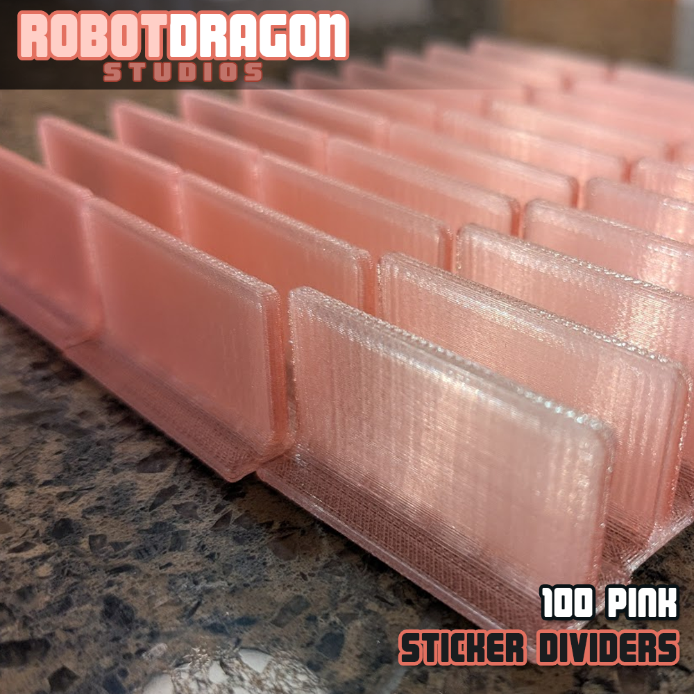 Close up photo of a row of 3D printed pink translucent PETG sticker dividers designed and created by Robot Dragon Studios for artist alley.