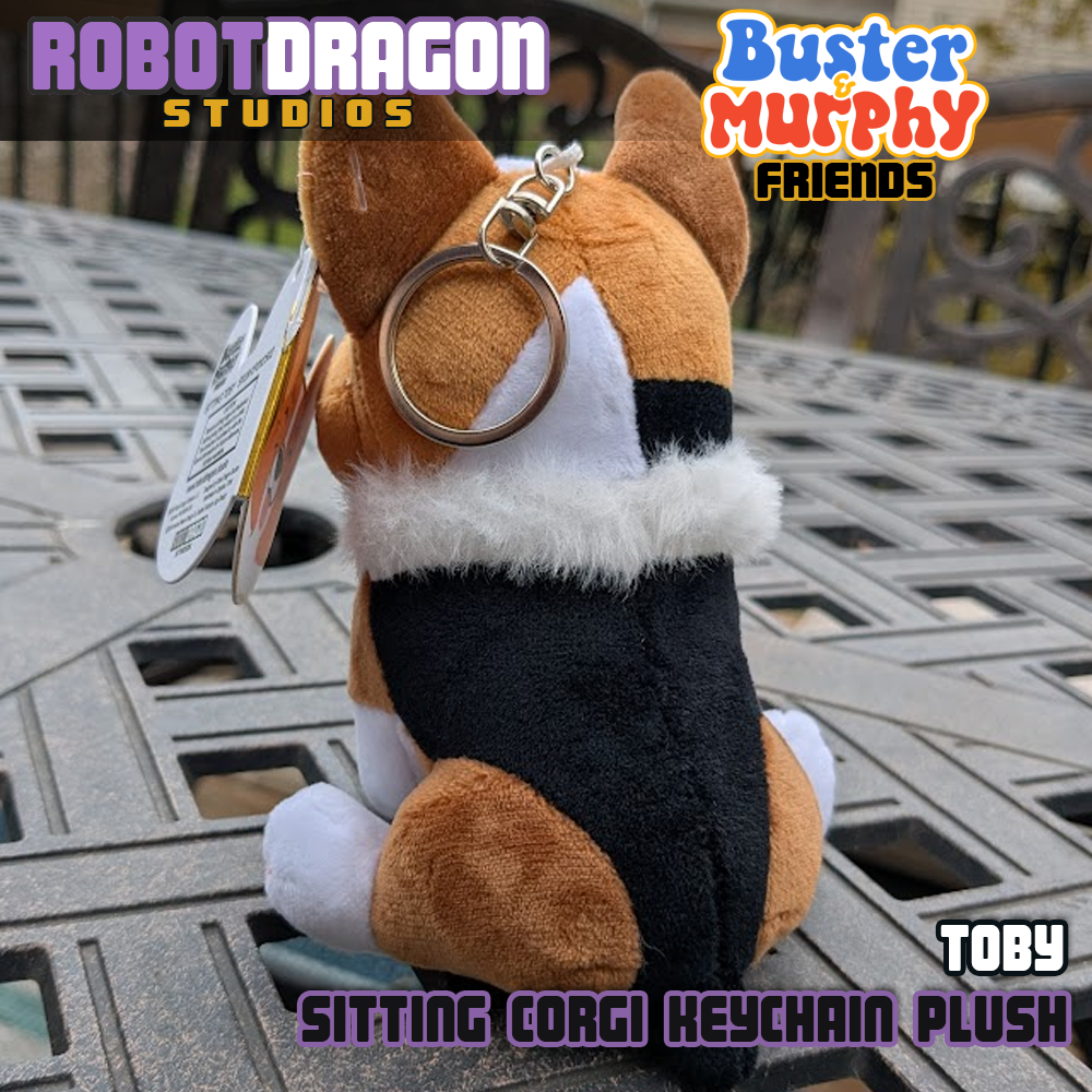 Backside closeup of a limited edition Toby red-headed tricolor corgi keychain designed and created by Robot Dragon Studios.