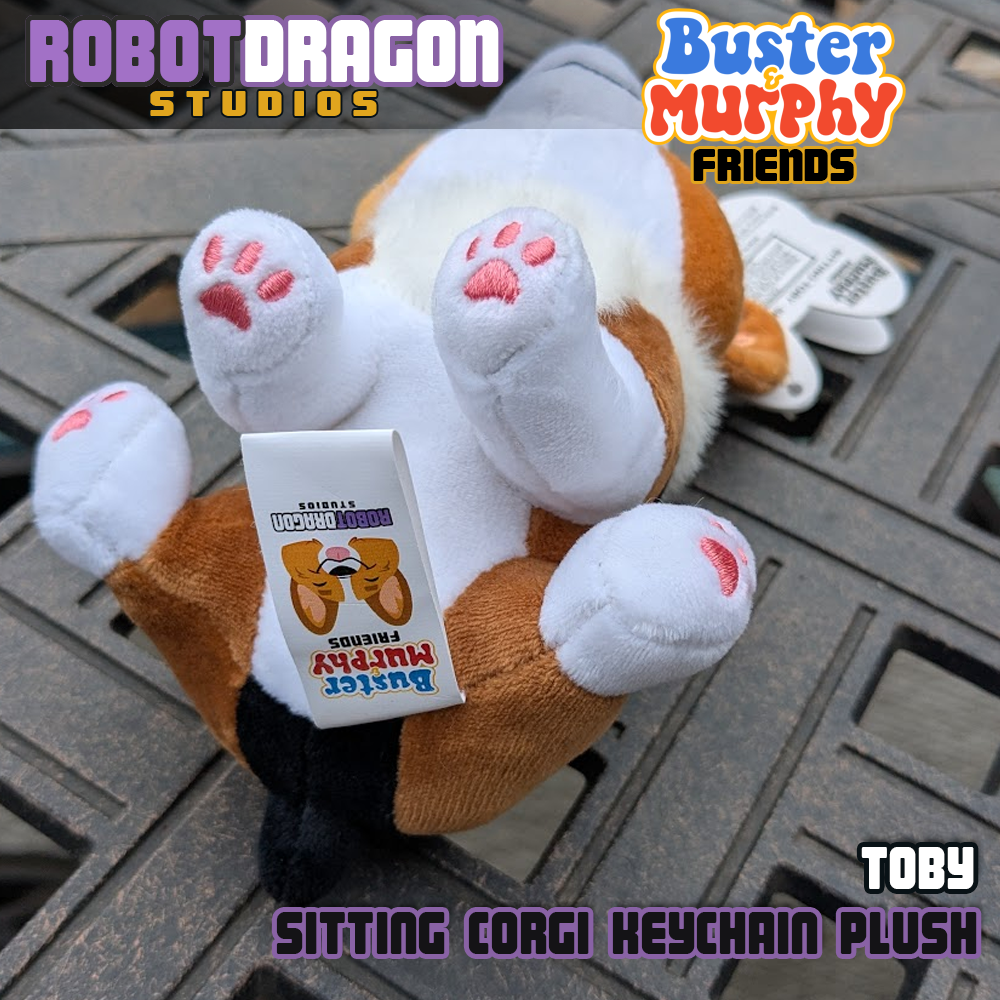 Bottom closeup of a limited edition Toby red-headed tricolor corgi keychain designed and created by Robot Dragon Studios.