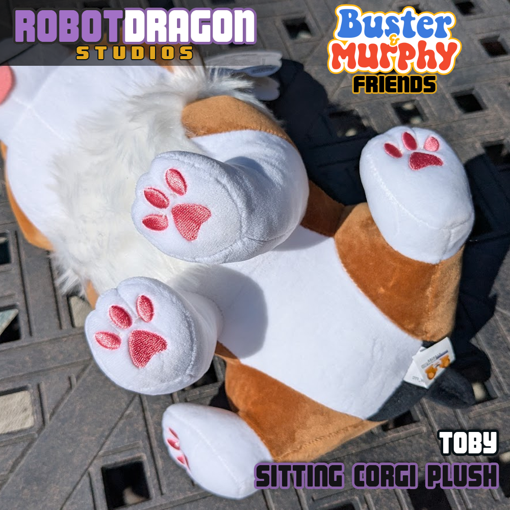 Bottom of a limited edition Toby red-headed tricolor corgi plush designed and created by Robot Dragon Studios.