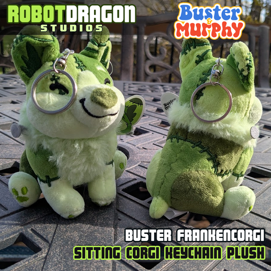 Front and backside of two Buster Frankencorgi keychains designed and created by Robot Dragon Studios.