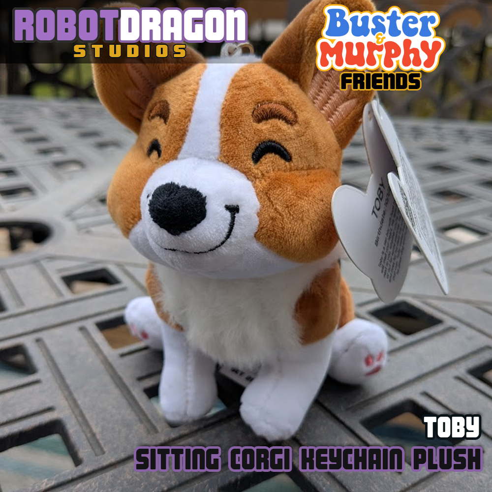 Front closeup of a limited edition Toby red-headed tricolor corgi keychain designed and created by Robot Dragon Studios.
