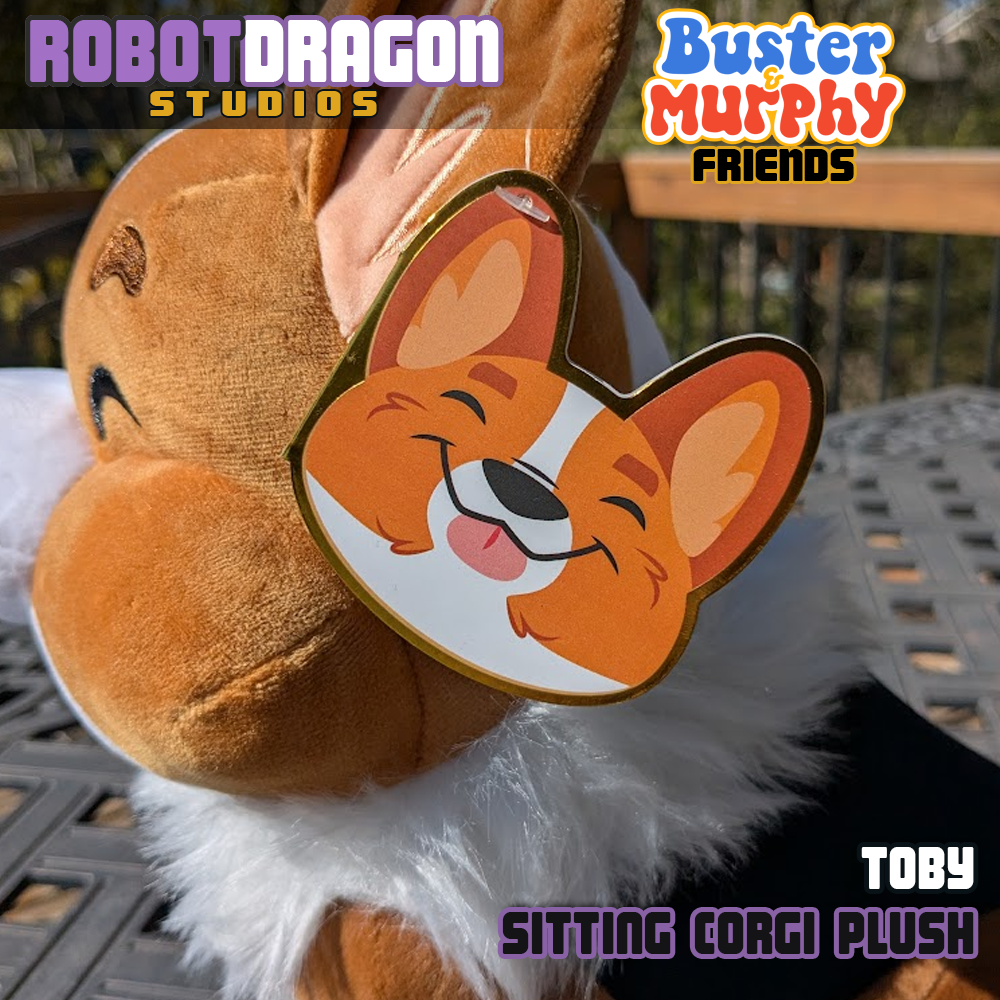 Front tag closeup on a limited edition Toby red-headed tricolor corgi plush designed and created by Robot Dragon Studios.