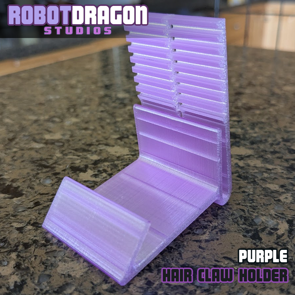 Front angle closeup photo of a 3D printed purple translucent PETG hair claw holder designed and created by Robot Dragon Studios for artist alley.