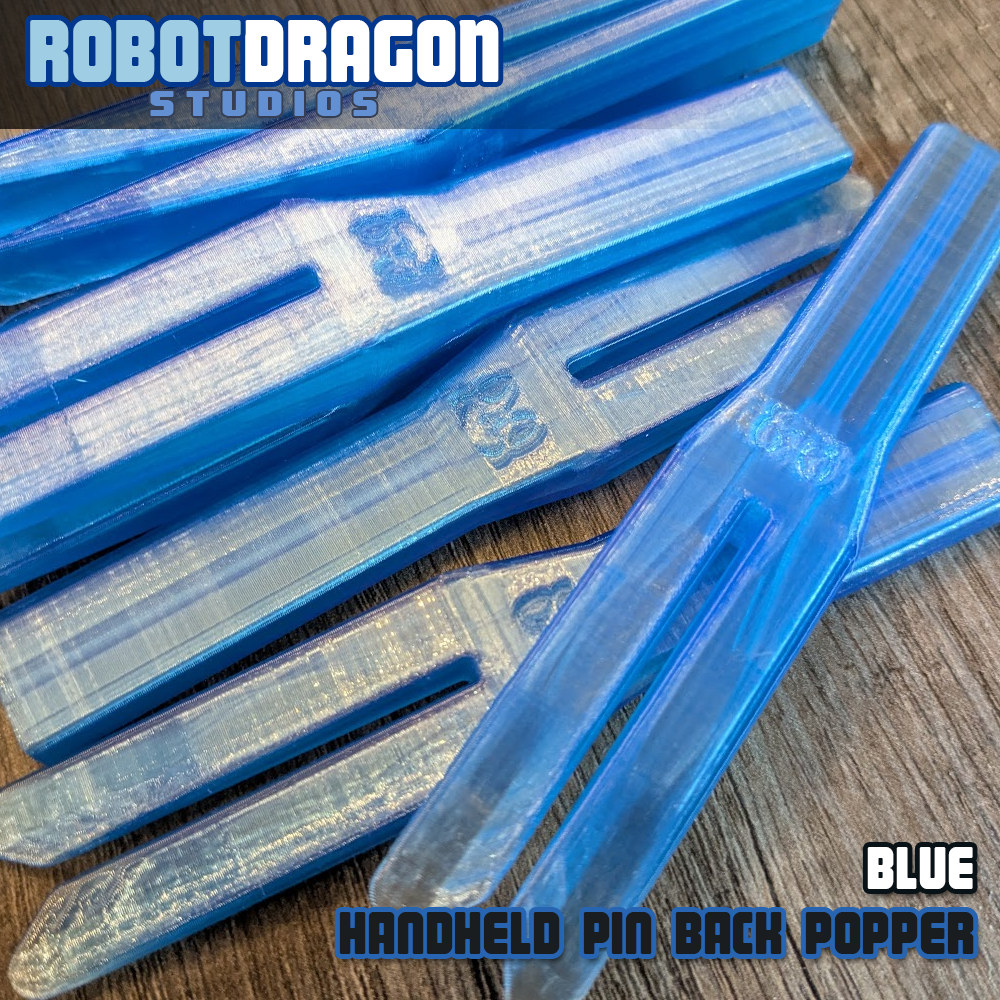 Blue 3D printed handheld enamel pin pin-back popper from Robot Dragon Studios