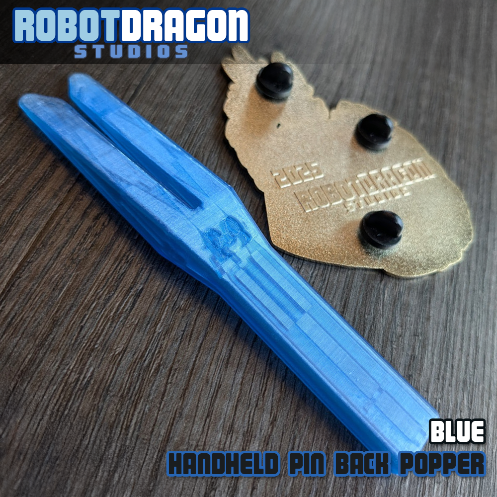 Blue 3D printed handheld enamel pin pin-back popper from Robot Dragon Studios
