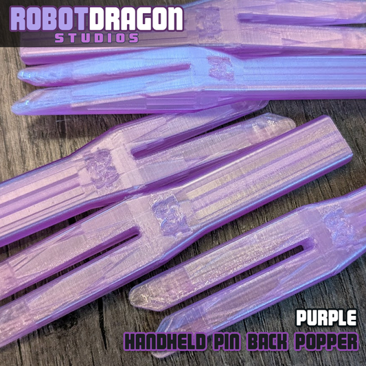 Purple 3D printed handheld enamel pin pin-back popper from Robot Dragon Studios