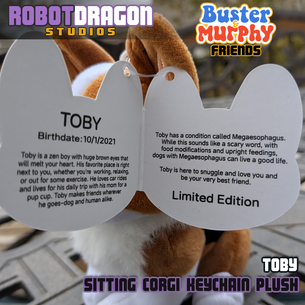 Closeup inside text of the limited edition Toby red-headed tricolor corgi keychain tag designed and created by Robot Dragon Studios.