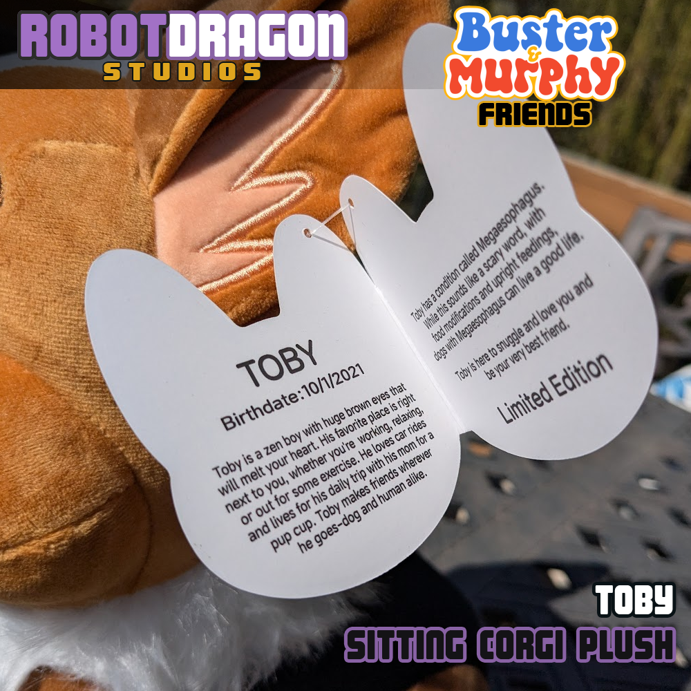 Inside tag closeup on a limited edition Toby red-headed tricolor corgi plush designed and created by Robot Dragon Studios.