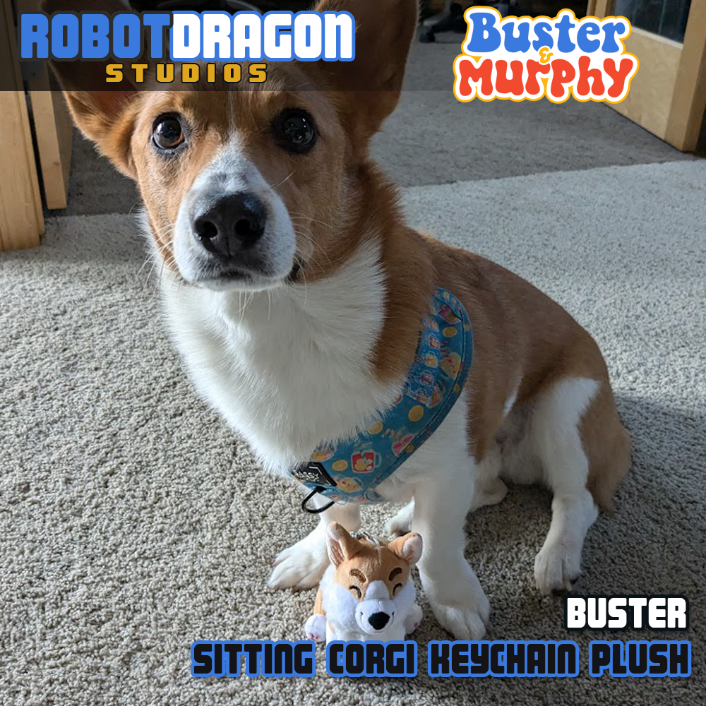 Chip, a real red Pembroke corgi, posing with a Buster red Pembroke corgi keychain designed and created by Robot Dragon Studios.