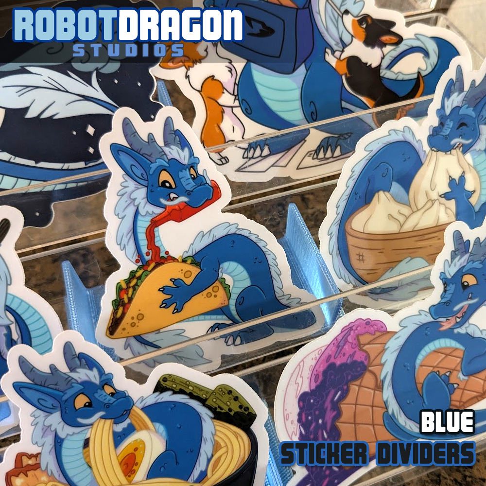 Example of 3D printed blue translucent PETG sticker dividers in use in a sticker display designed and created by Robot Dragon Studios for artist alley, also visible are Nebula the dragon with favorite foods and friends.