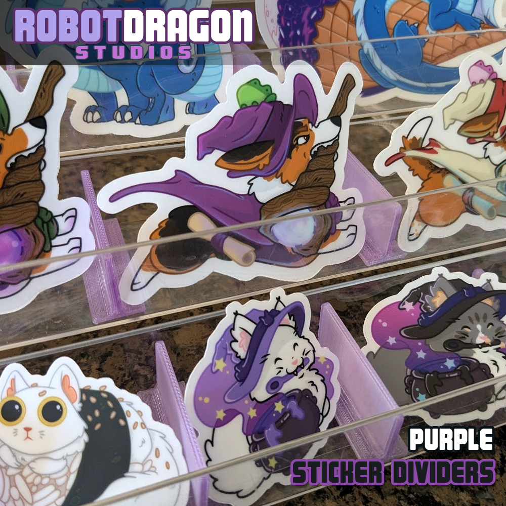 Example of 3D printed purple translucent PETG sticker dividers in use in a sticker display designed and created by Robot Dragon Studios for artist alley, also visible are Wizard Corgis, Witch Kitty's, Sushi Cat, and Nebula the dragon with food.