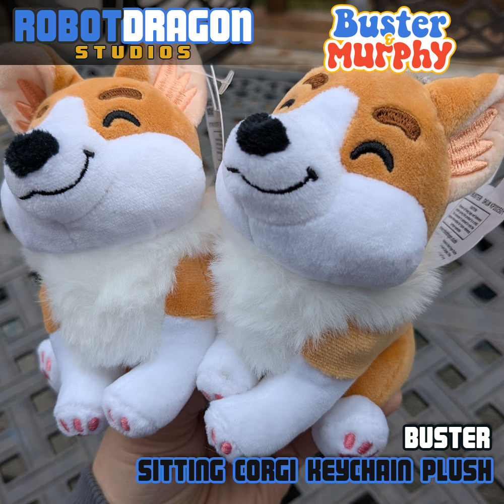 Two closeup Buster red Pembroke corgi keychains designed and created by Robot Dragon Studios.