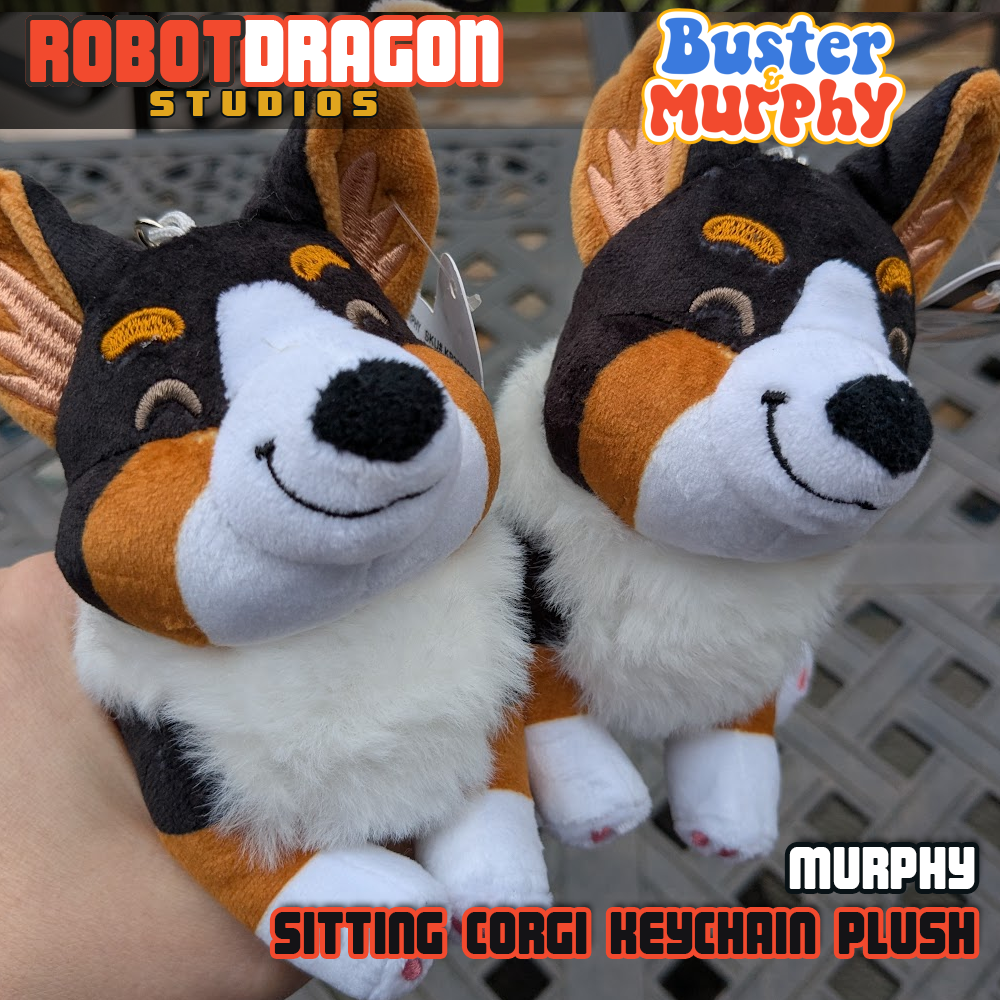 Two closeup Murphy black tricolor Pembroke corgi keychains designed and created by Robot Dragon Studios.